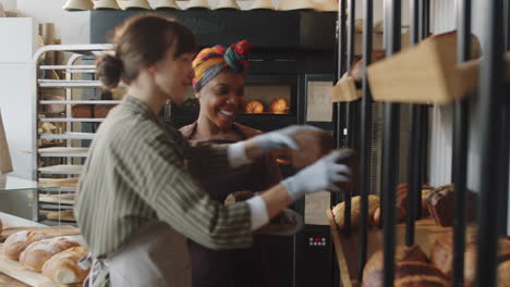 Diverse-Female-Colleagues-Working-Together-in-Bakery